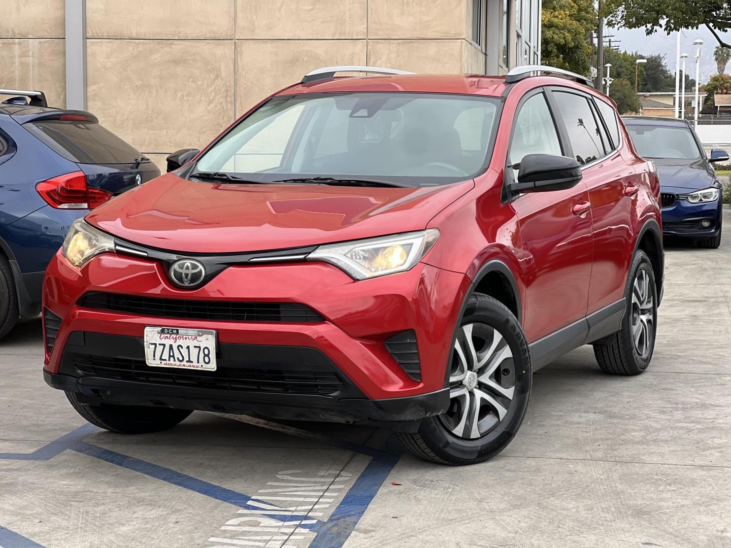 2017 Ruby Red /Gray Toyota RAV4 LE FWD (2T3ZFREV1HW) with an 2.5L L4 DOHC 16V engine, 6A transmission, located at 30 S. Berkeley Avenue, Pasadena, CA, 91107, (626) 248-7567, 34.145447, -118.109398 - Photo#0