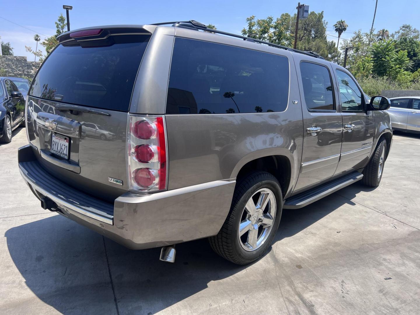 2011 Silver Metallic /Tan Chevrolet Suburban LTZ 1500 4WD (1GNSKKE31BR) with an 5.3L V8 OHV 16V FFV engine, 4-Speed Automatic transmission, located at 30 S. Berkeley Avenue, Pasadena, CA, 91107, (626) 248-7567, 34.145447, -118.109398 - 2011 Chevrolet Suburban LT 4WD – 3rd Row – $995 Down – Buy Here Pay Here – Bad Credit OK – Crown City Motors – Pasadena, CA Looking for a full-size SUV that offers unmatched space, power, and versatility? Look no further than this 2011 Chevrolet Suburban LT 4WD, now available at Crown - Photo#2