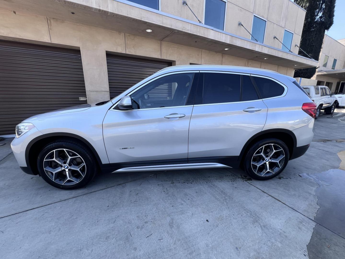 2018 Silver Metallic /Black BMW X1 sDrive28i (WBXHU7C34J5) with an 2.0L L4 DOHC 16V engine, 8A transmission, located at 30 S. Berkeley Avenue, Pasadena, CA, 91107, (626) 248-7567, 34.145447, -118.109398 - 2018 BMW X1 xDrive28i – Luxury, Performance, and Affordability in One SUV VIN: WBXHU7C34J5H42594 Location: Crown City Motors, Pasadena, CA Status: Available Now – Clean Title – Financing Options for All Credit Types Looking for a luxury crossover SUV that combines sporty performance, ele - Photo#9