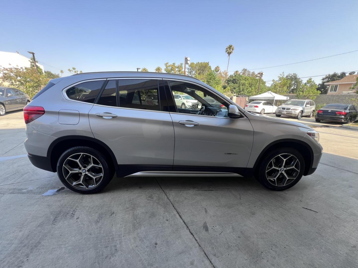 2018 Silver Metallic /Black BMW X1 sDrive28i (WBXHU7C34J5) with an 2.0L L4 DOHC 16V engine, 8A transmission, located at 30 S. Berkeley Avenue, Pasadena, CA, 91107, (626) 248-7567, 34.145447, -118.109398 - 2018 BMW X1 xDrive28i – Luxury, Performance, and Affordability in One SUV VIN: WBXHU7C34J5H42594 Location: Crown City Motors, Pasadena, CA Status: Available Now – Clean Title – Financing Options for All Credit Types Looking for a luxury crossover SUV that combines sporty performance, ele - Photo#15