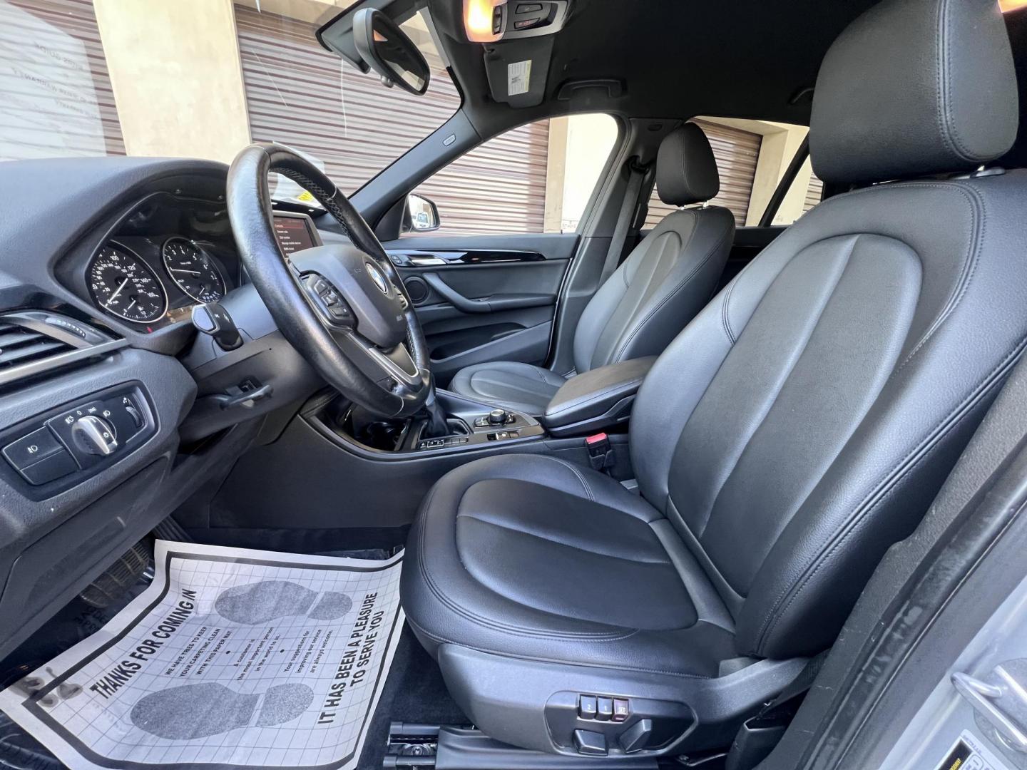 2018 Silver Metallic /Black BMW X1 sDrive28i (WBXHU7C34J5) with an 2.0L L4 DOHC 16V engine, 8A transmission, located at 30 S. Berkeley Avenue, Pasadena, CA, 91107, (626) 248-7567, 34.145447, -118.109398 - 2018 BMW X1 xDrive28i – Luxury, Performance, and Affordability in One SUV VIN: WBXHU7C34J5H42594 Location: Crown City Motors, Pasadena, CA Status: Available Now – Clean Title – Financing Options for All Credit Types Looking for a luxury crossover SUV that combines sporty performance, ele - Photo#22