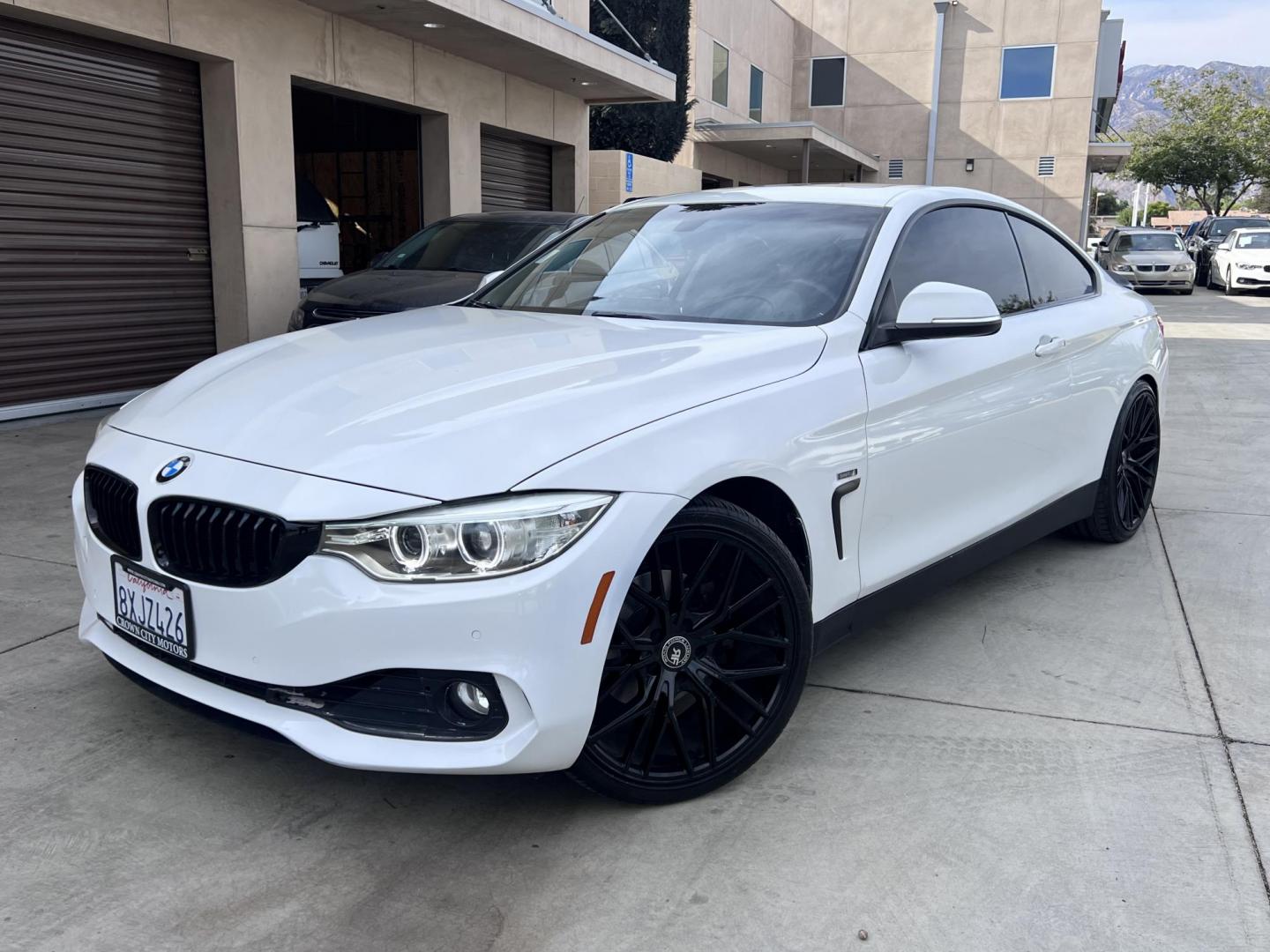 2015 White /black BMW 4-Series 428i SULEV Coupe (WBA3N7C58FK) with an 2.0L L4 DOHC 16V engine, 8-Speed Automatic transmission, located at 30 S. Berkeley Avenue, Pasadena, CA, 91107, (626) 248-7567, 34.145447, -118.109398 - Crown City Motors is a used “Buy Here Pay Here” car dealer in Pasadena CA. “Buy Here Pay Here” financing, means that when you purchase your vehicle from our dealership, that you make the payments to the dealership as well. We do not need the banks approval to get you approved for a used auto - Photo#0