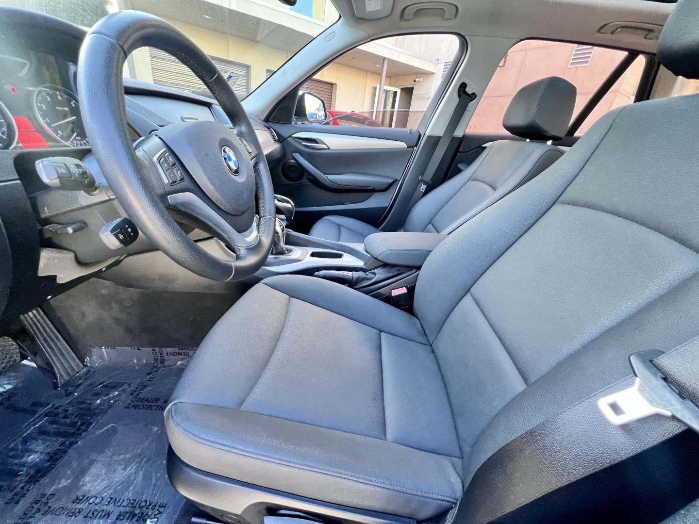 2014 White /beige BMW X1 sDrive28i (WBAVM1C50EV) with an 2.0L L4 DOHC 16V engine, 8-Speed Automatic transmission, located at 30 S. Berkeley Avenue, Pasadena, CA, 91107, (626) 248-7567, 34.145447, -118.109398 - Crown City Motors is a used “Buy Here Pay Here” car dealer in Pasadena CA. “Buy Here Pay Here” financing, means that when you purchase your vehicle from our dealership, that you make the payments to the dealership as well. We do not need the banks approval to get you approved for a used auto - Photo#9