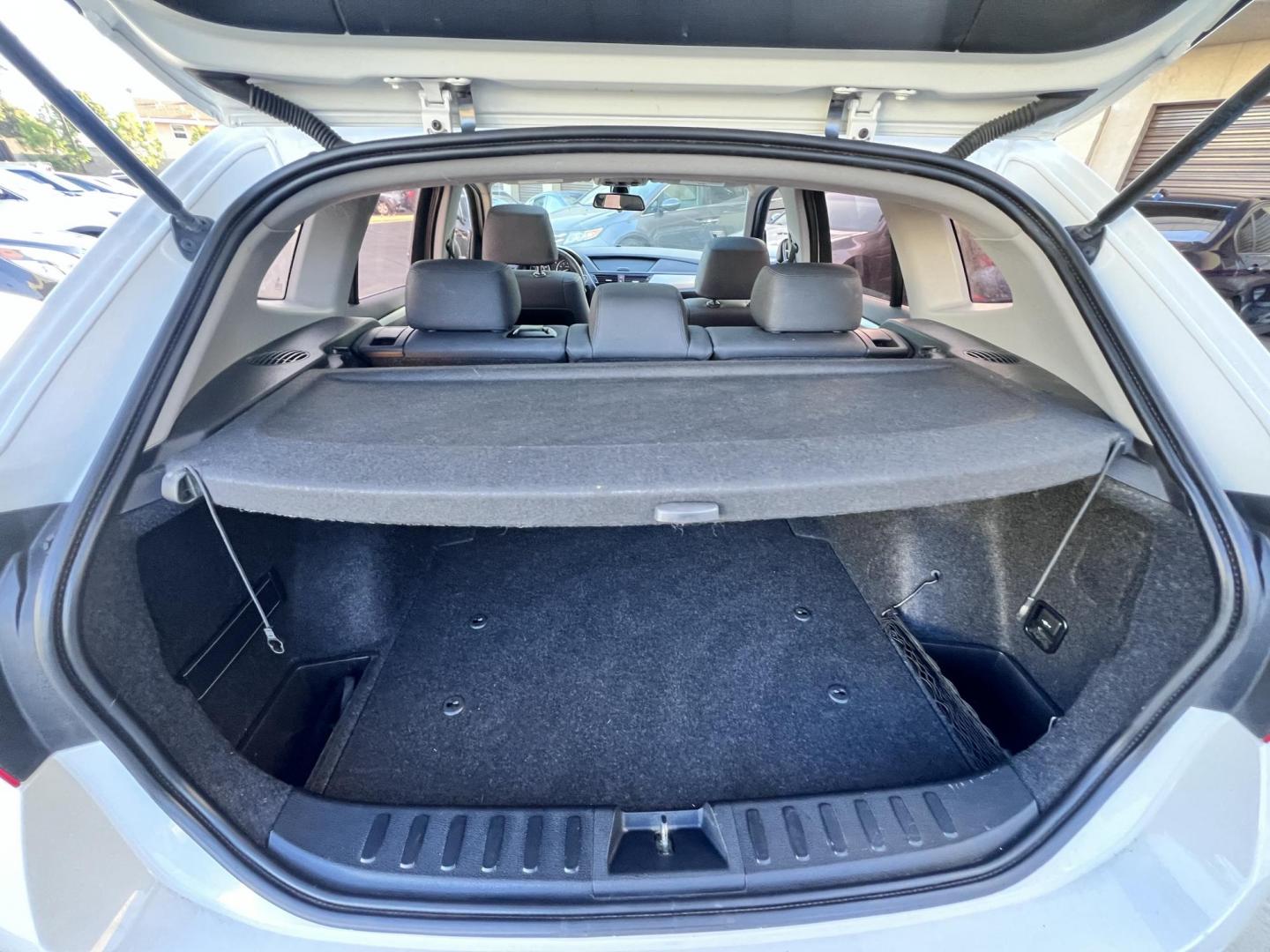 2014 White /beige BMW X1 sDrive28i (WBAVM1C50EV) with an 2.0L L4 DOHC 16V engine, 8-Speed Automatic transmission, located at 30 S. Berkeley Avenue, Pasadena, CA, 91107, (626) 248-7567, 34.145447, -118.109398 - Crown City Motors is a used “Buy Here Pay Here” car dealer in Pasadena CA. “Buy Here Pay Here” financing, means that when you purchase your vehicle from our dealership, that you make the payments to the dealership as well. We do not need the banks approval to get you approved for a used auto - Photo#16