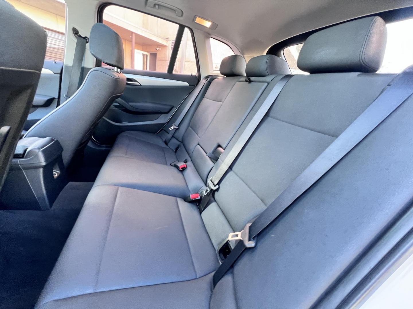 2014 White /beige BMW X1 sDrive28i (WBAVM1C50EV) with an 2.0L L4 DOHC 16V engine, 8-Speed Automatic transmission, located at 30 S. Berkeley Avenue, Pasadena, CA, 91107, (626) 248-7567, 34.145447, -118.109398 - Crown City Motors is a used “Buy Here Pay Here” car dealer in Pasadena CA. “Buy Here Pay Here” financing, means that when you purchase your vehicle from our dealership, that you make the payments to the dealership as well. We do not need the banks approval to get you approved for a used auto - Photo#17