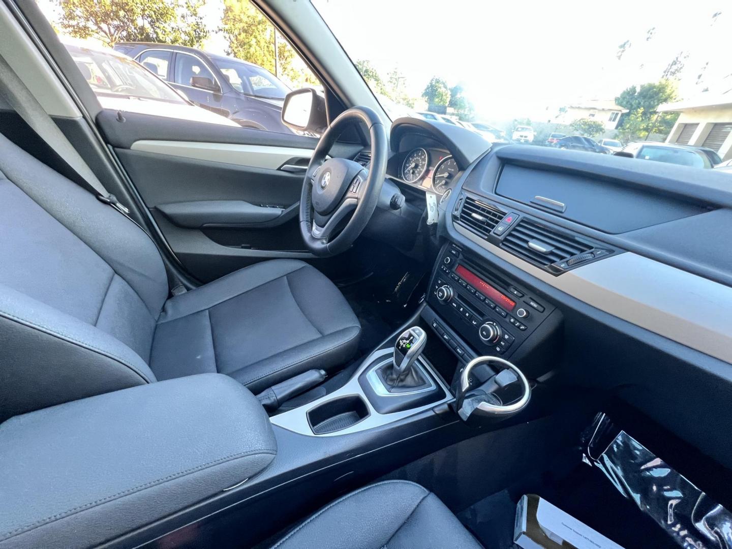 2014 White /beige BMW X1 sDrive28i (WBAVM1C50EV) with an 2.0L L4 DOHC 16V engine, 8-Speed Automatic transmission, located at 30 S. Berkeley Avenue, Pasadena, CA, 91107, (626) 248-7567, 34.145447, -118.109398 - Crown City Motors is a used “Buy Here Pay Here” car dealer in Pasadena CA. “Buy Here Pay Here” financing, means that when you purchase your vehicle from our dealership, that you make the payments to the dealership as well. We do not need the banks approval to get you approved for a used auto - Photo#20