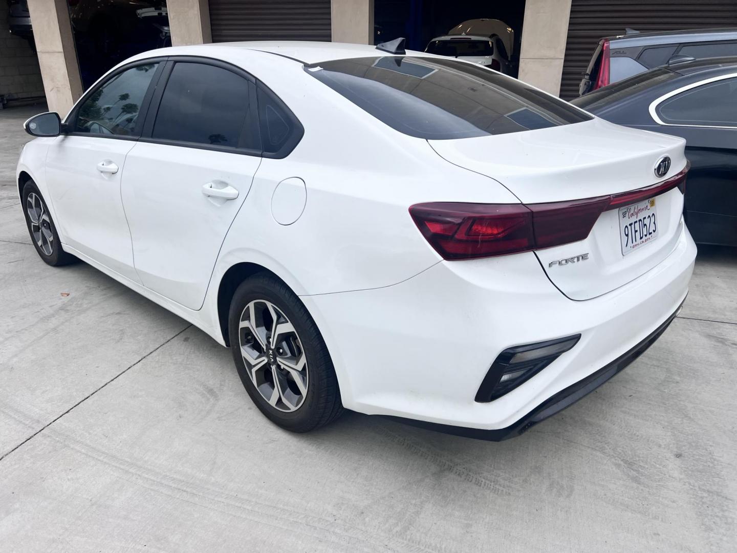 2021 White /black Kia Forte FE (3KPF24AD3ME) with an 2.0L L4 DOHC 16V engine, CVT transmission, located at 30 S. Berkeley Avenue, Pasadena, CA, 91107, (626) 248-7567, 34.145447, -118.109398 - Crown City Motors is a used “Buy Here Pay Here” car dealer in Pasadena CA. “Buy Here Pay Here” financing, means that when you purchase your vehicle from our dealership, that you make the payments to the dealership as well. We do not need the banks approval to get you approved for a used auto - Photo#2
