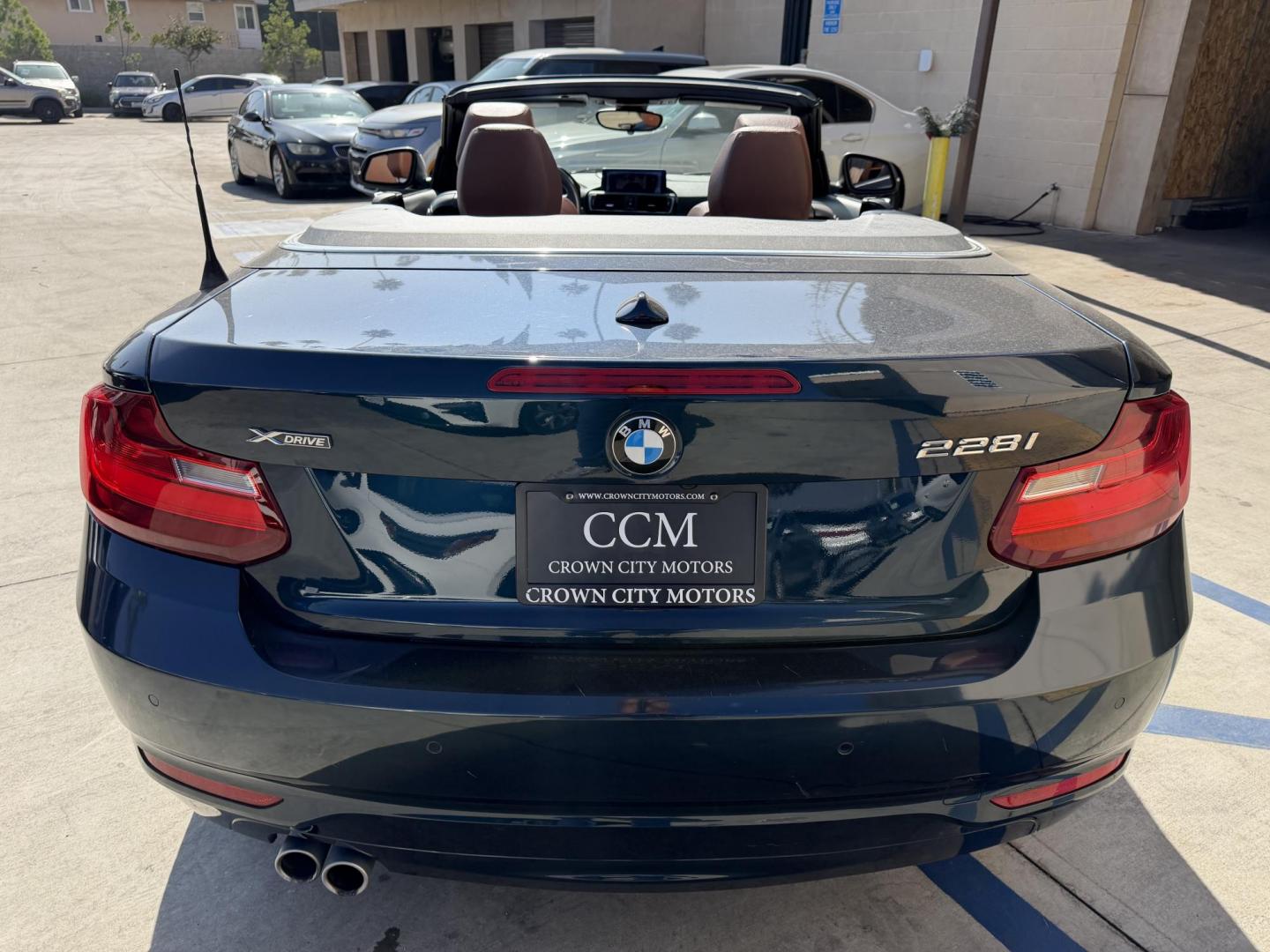 2015 Atlantis Metallic /Black BMW 2-Series 228xi Convertible (WBA1K7C54FV) with an 2.0L L4 DOHC 16V engine, 8A transmission, located at 30 S. Berkeley Avenue, Pasadena, CA, 91107, (626) 248-7567, 34.145447, -118.109398 - 2015 BMW 228i Convertible – Atlantis Metallic | Luxury, Style & Easy Financing in Pasadena Turn heads wherever you go in this stunning 2015 BMW 228i Convertible, finished in rare Atlantis Metallic, a gorgeous blue-green color that shifts beautifully in the sunlight. With its black leather inter - Photo#3