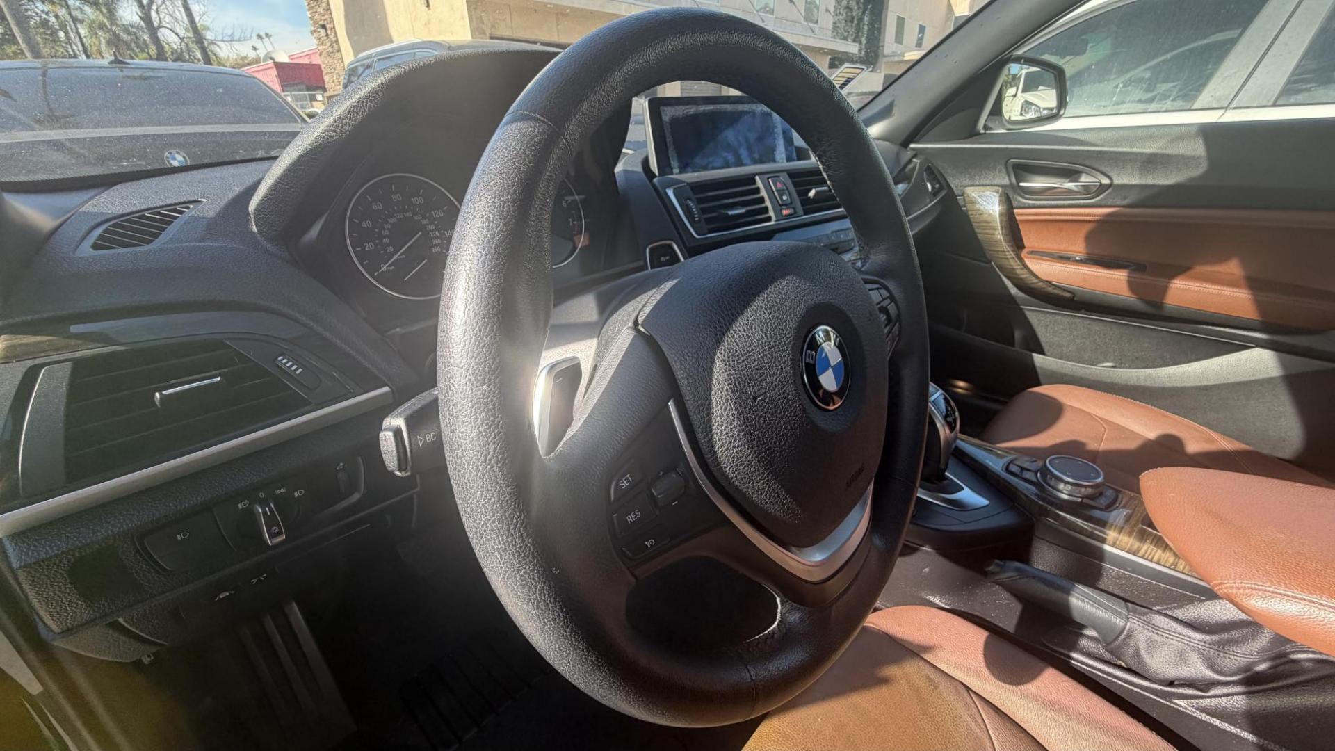 2015 Atlantis Metallic /Black BMW 2-Series 228xi Convertible (WBA1K7C54FV) with an 2.0L L4 DOHC 16V engine, 8A transmission, located at 30 S. Berkeley Avenue, Pasadena, CA, 91107, (626) 248-7567, 34.145447, -118.109398 - 2015 BMW 228i Convertible – Atlantis Metallic | Luxury, Style & Easy Financing in Pasadena Turn heads wherever you go in this stunning 2015 BMW 228i Convertible, finished in rare Atlantis Metallic, a gorgeous blue-green color that shifts beautifully in the sunlight. With its black leather inter - Photo#6
