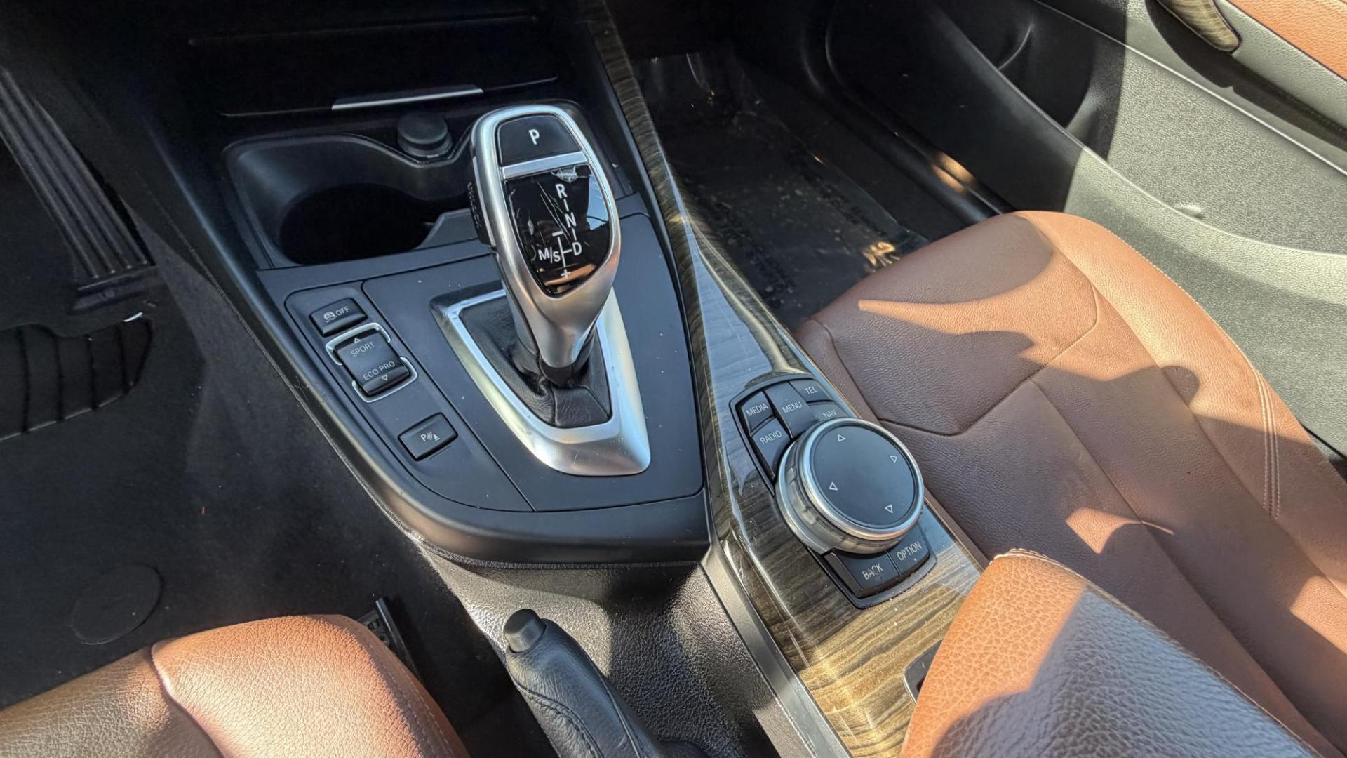 2015 Atlantis Metallic /Black BMW 2-Series 228xi Convertible (WBA1K7C54FV) with an 2.0L L4 DOHC 16V engine, 8A transmission, located at 30 S. Berkeley Avenue, Pasadena, CA, 91107, (626) 248-7567, 34.145447, -118.109398 - 2015 BMW 228i Convertible – Atlantis Metallic | Luxury, Style & Easy Financing in Pasadena Turn heads wherever you go in this stunning 2015 BMW 228i Convertible, finished in rare Atlantis Metallic, a gorgeous blue-green color that shifts beautifully in the sunlight. With its black leather inter - Photo#16