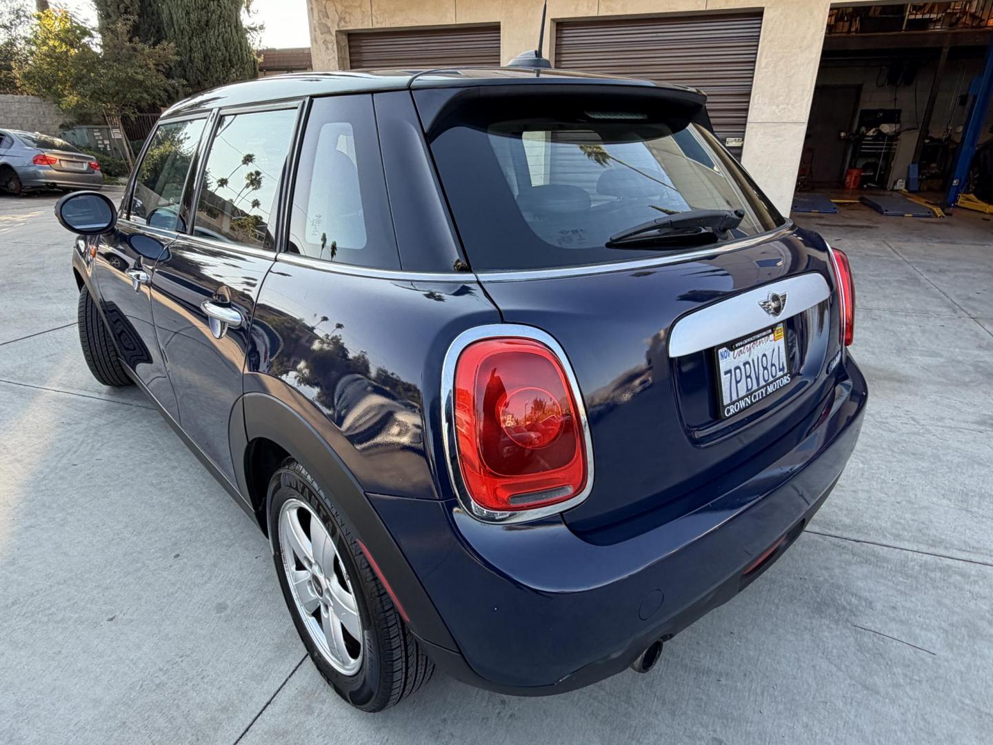 2015 Deep Blue Metallic /Black Mini Cooper Base (WMWXS5C50FT) with an 1.5L L3 engine, Automatic transmission, located at 30 S. Berkeley Avenue, Pasadena, CA, 91107, (626) 248-7567, 34.145447, -118.109398 - 2015 MINI Cooper Hardtop – Deep Blue Metallic | Style, Efficiency & Easy Financing in Pasadena Drive away in this stylish and fun-to-drive 2015 MINI Cooper Hardtop, finished in stunning Deep Blue Metallic with a black interior. Compact, sporty, and full of character, this MINI delivers world-cl - Photo#2