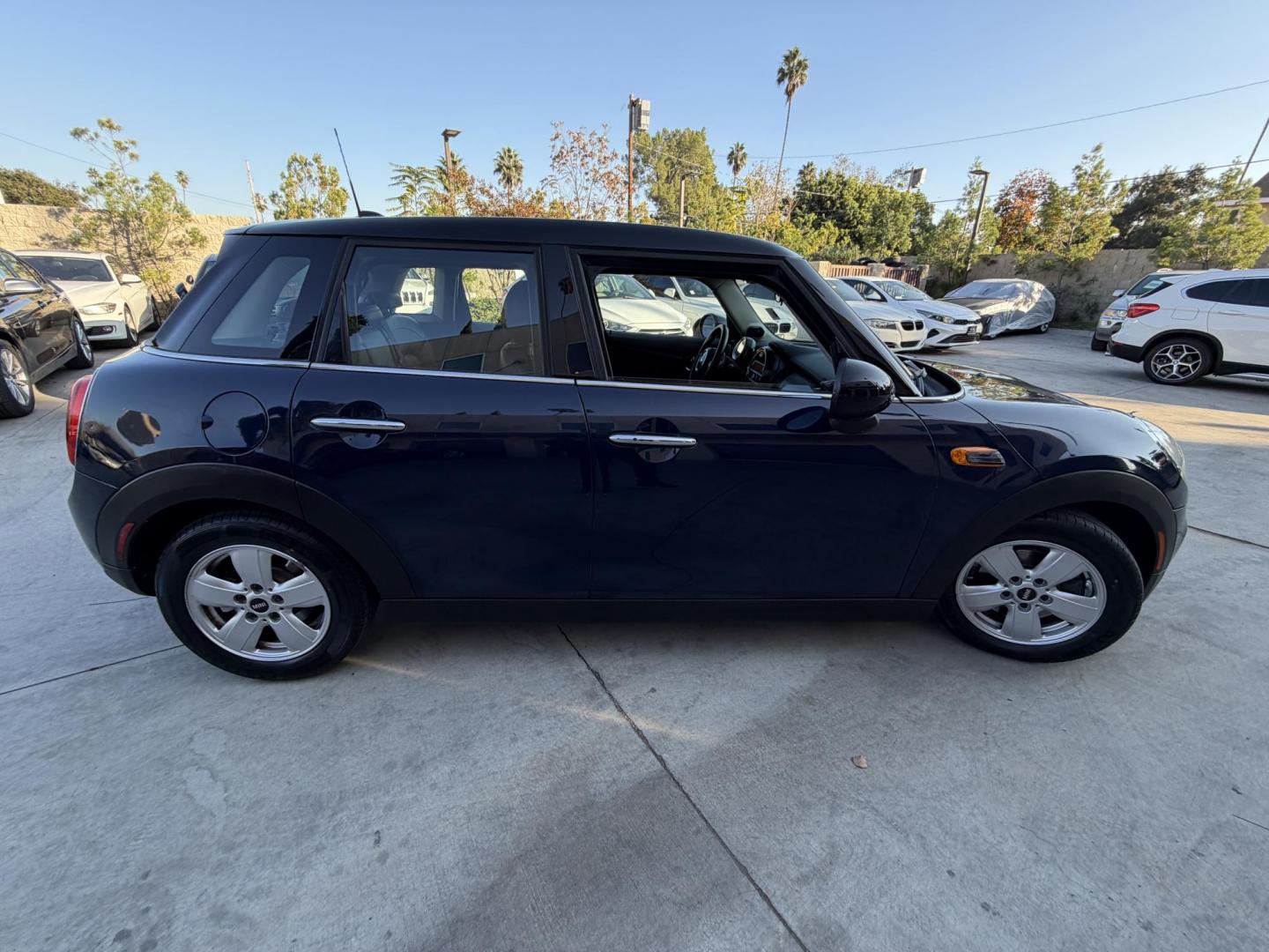 2015 Deep Blue Metallic /Black Mini Cooper Base (WMWXS5C50FT) with an 1.5L L3 engine, Automatic transmission, located at 30 S. Berkeley Avenue, Pasadena, CA, 91107, (626) 248-7567, 34.145447, -118.109398 - 2015 MINI Cooper Hardtop – Deep Blue Metallic | Style, Efficiency & Easy Financing in Pasadena Drive away in this stylish and fun-to-drive 2015 MINI Cooper Hardtop, finished in stunning Deep Blue Metallic with a black interior. Compact, sporty, and full of character, this MINI delivers world-cl - Photo#5