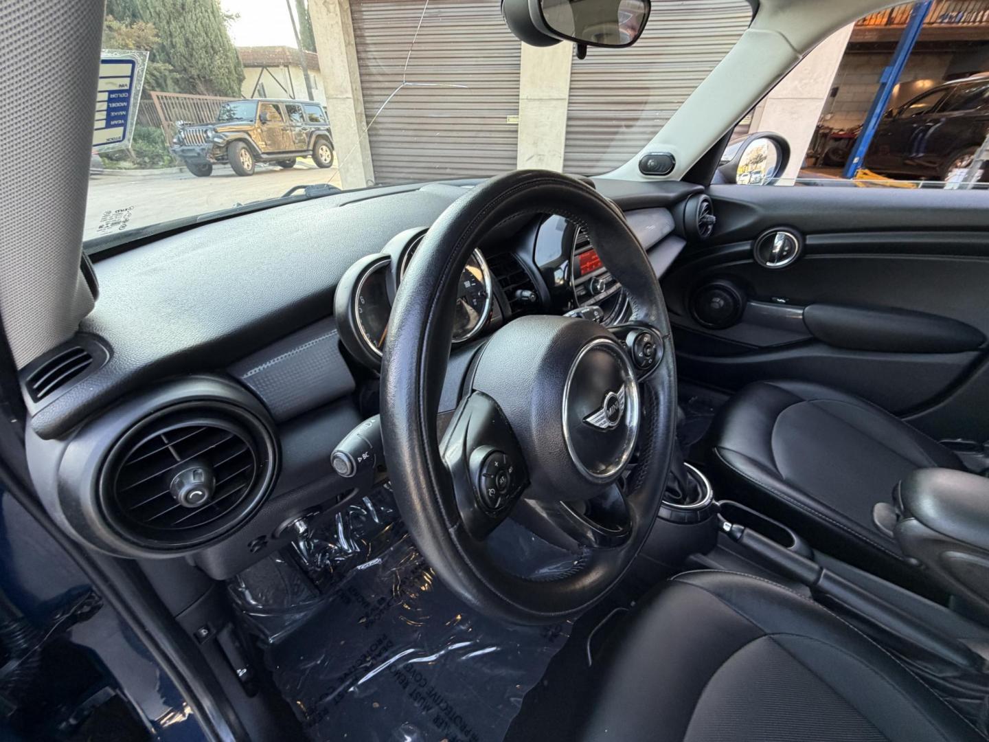2015 Deep Blue Metallic /Black Mini Cooper Base (WMWXS5C50FT) with an 1.5L L3 engine, Automatic transmission, located at 30 S. Berkeley Avenue, Pasadena, CA, 91107, (626) 248-7567, 34.145447, -118.109398 - 2015 MINI Cooper Hardtop – Deep Blue Metallic | Style, Efficiency & Easy Financing in Pasadena Drive away in this stylish and fun-to-drive 2015 MINI Cooper Hardtop, finished in stunning Deep Blue Metallic with a black interior. Compact, sporty, and full of character, this MINI delivers world-cl - Photo#12