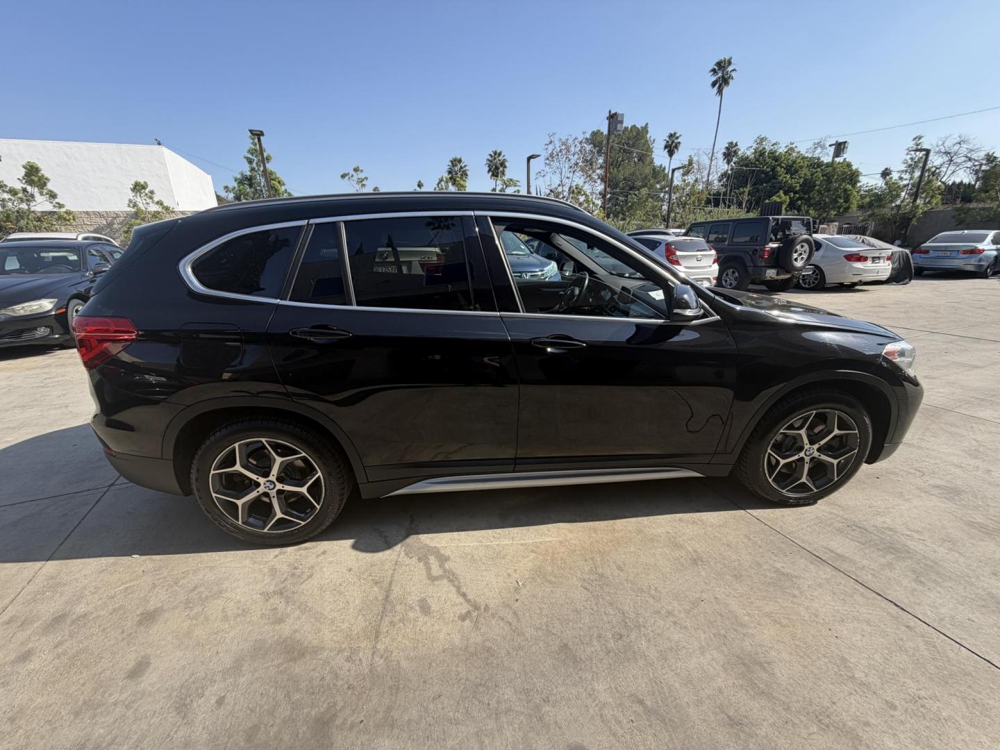 2018 Black /Black BMW X1 xDrive28i (WBXHT3C35J5) with an 2.0L L4 DOHC 16V engine, 8A transmission, located at 30 S. Berkeley Avenue, Pasadena, CA, 91107, (626) 248-7567, 34.145447, -118.109398 - BMW X1 – Black on Black – VIN: WBXHT3C35J5L28331 Luxury SUV with Buy Here Pay Here Financing – Crown City Motors, Pasadena If you’re looking for a luxury SUV with bad credit financing, this black on black BMW X3 is an excellent choice. Available now at Crown City Motors in Pasadena, th - Photo#8