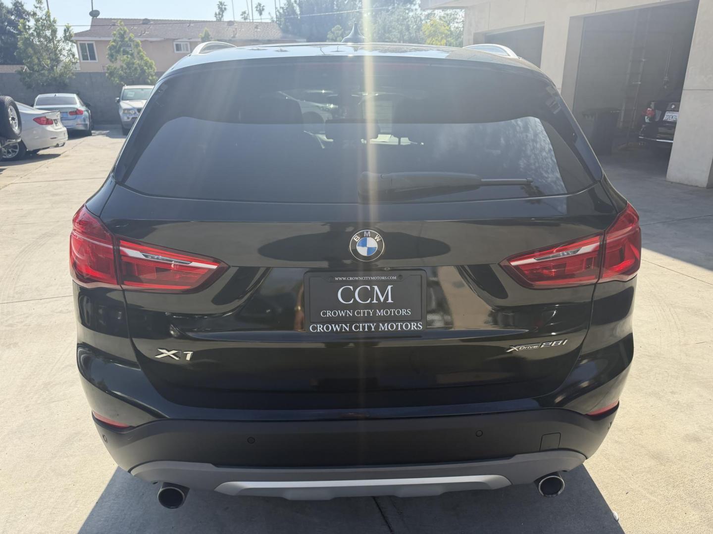 2018 Black /Black BMW X1 xDrive28i (WBXHT3C35J5) with an 2.0L L4 DOHC 16V engine, 8A transmission, located at 30 S. Berkeley Avenue, Pasadena, CA, 91107, (626) 248-7567, 34.145447, -118.109398 - BMW X1 – Black on Black – VIN: WBXHT3C35J5L28331 Luxury SUV with Buy Here Pay Here Financing – Crown City Motors, Pasadena If you’re looking for a luxury SUV with bad credit financing, this black on black BMW X3 is an excellent choice. Available now at Crown City Motors in Pasadena, th - Photo#9