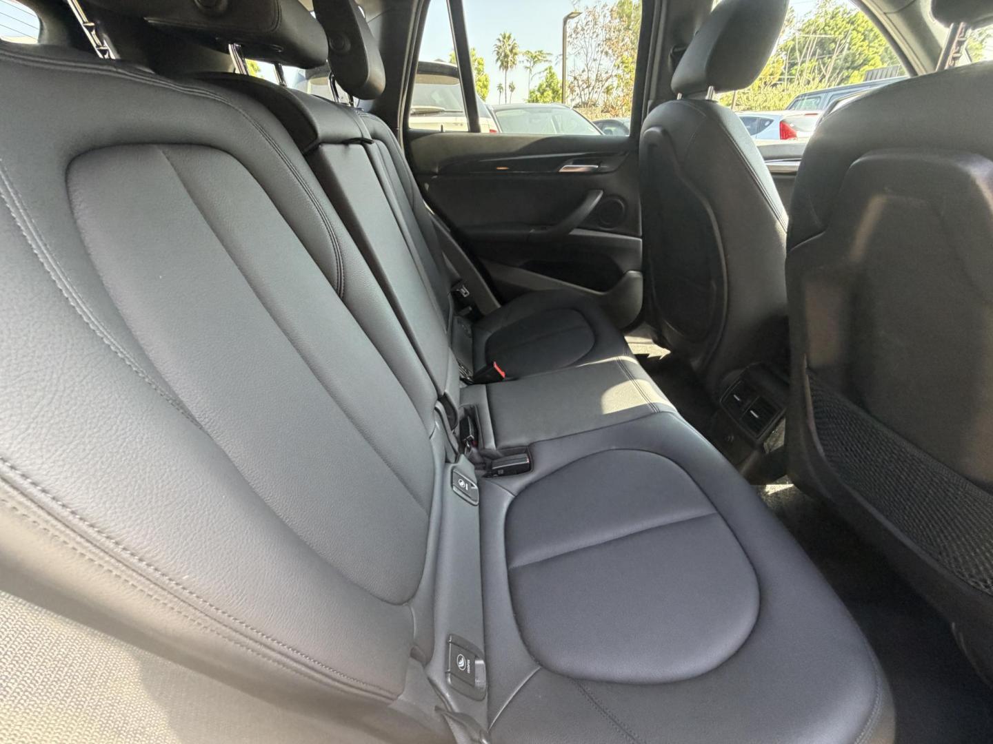 2018 Black /Black BMW X1 xDrive28i (WBXHT3C35J5) with an 2.0L L4 DOHC 16V engine, 8A transmission, located at 30 S. Berkeley Avenue, Pasadena, CA, 91107, (626) 248-7567, 34.145447, -118.109398 - BMW X1 – Black on Black – VIN: WBXHT3C35J5L28331 Luxury SUV with Buy Here Pay Here Financing – Crown City Motors, Pasadena If you’re looking for a luxury SUV with bad credit financing, this black on black BMW X3 is an excellent choice. Available now at Crown City Motors in Pasadena, th - Photo#26