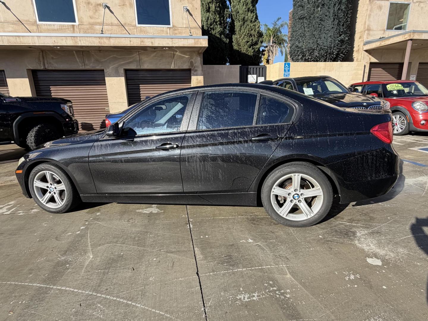 2012 BLACK /Black BMW 3-Series 328i Sedan (WBA3C1C51CF) with an 2.0L L4 DOHC 16V engine, located at 30 S. Berkeley Avenue, Pasadena, CA, 91107, (626) 248-7567, 34.145447, -118.109398 - This BMW 3 Series sedan offers the perfect blend of performance, comfort, and everyday usability. With only 82,000 miles, it has significantly lower mileage than average for its year, making it a smart option for buyers who want a well-maintained luxury vehicle. Highlights commonly associated wit - Photo#1