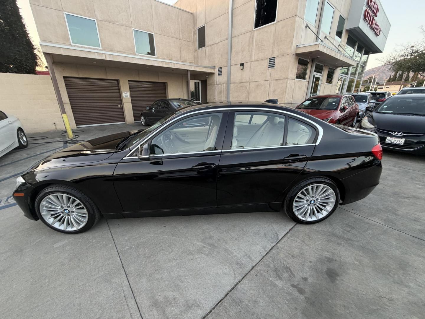 2014 Black /BEIGE BMW 3-Series 328i Sedan (WBA3C1C58EK) with an 2.0L L4 DOHC 16V engine, located at 30 S. Berkeley Avenue, Pasadena, CA, 91107, (626) 248-7567, 34.145447, -118.109398 - Crown City Motors is a used “Buy Here Pay Here” car dealer in Pasadena CA. “Buy Here Pay Here” financing, means that when you purchase your vehicle from our dealership, that you make the payments to the dealership as well. We do not need the banks approval to get you approved for a used auto - Photo#5
