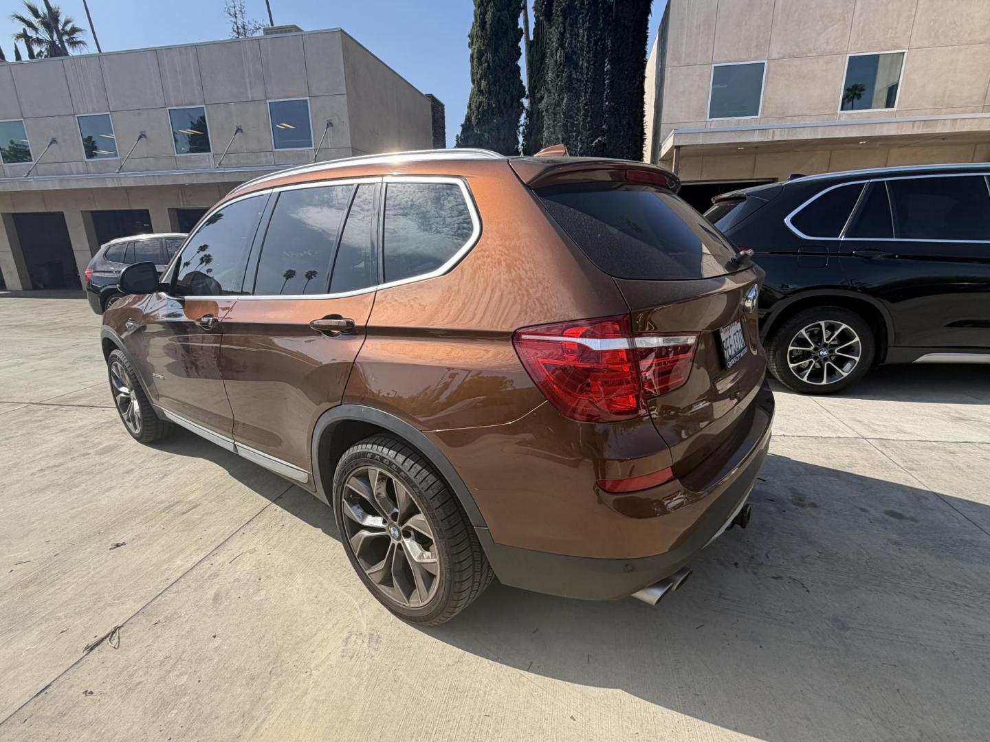 2017 Barcelona Red Metallic BMW X3 xDrive28i (5UXWX9C56H0) with an 2.0L L4 DOHC 16V engine, 8A transmission, located at 30 S. Berkeley Avenue, Pasadena, CA, 91107, (626) 248-7567, 34.145447, -118.109398 - Crown City Motors is a used “Buy Here Pay Here” car dealer in Pasadena CA. “Buy Here Pay Here” financing, means that when you purchase your vehicle from our dealership, that you make the payments to the dealership as well. We do not need the banks approval to get you approved for a used auto - Photo#2