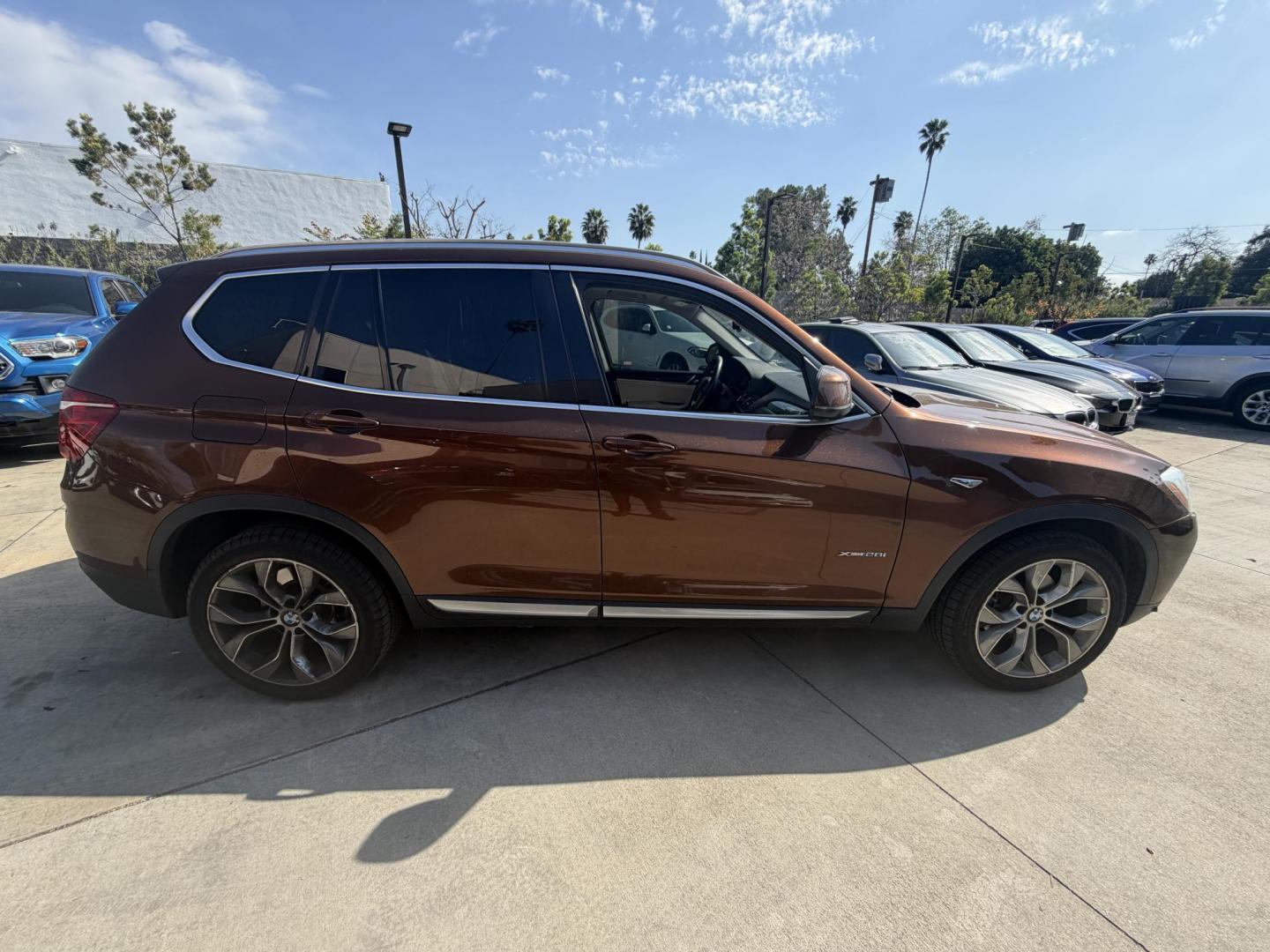 2017 Barcelona Red Metallic BMW X3 xDrive28i (5UXWX9C56H0) with an 2.0L L4 DOHC 16V engine, 8A transmission, located at 30 S. Berkeley Avenue, Pasadena, CA, 91107, (626) 248-7567, 34.145447, -118.109398 - Crown City Motors is a used “Buy Here Pay Here” car dealer in Pasadena CA. “Buy Here Pay Here” financing, means that when you purchase your vehicle from our dealership, that you make the payments to the dealership as well. We do not need the banks approval to get you approved for a used auto - Photo#3