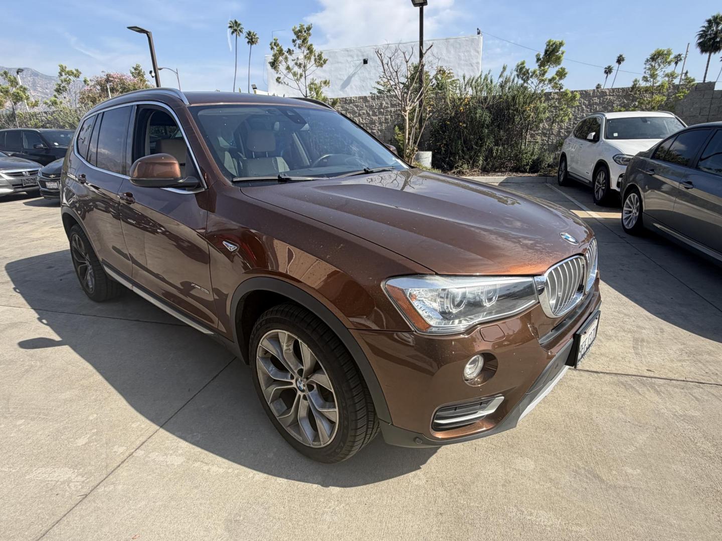 2017 Barcelona Red Metallic BMW X3 xDrive28i (5UXWX9C56H0) with an 2.0L L4 DOHC 16V engine, 8A transmission, located at 30 S. Berkeley Avenue, Pasadena, CA, 91107, (626) 248-7567, 34.145447, -118.109398 - Crown City Motors is a used “Buy Here Pay Here” car dealer in Pasadena CA. “Buy Here Pay Here” financing, means that when you purchase your vehicle from our dealership, that you make the payments to the dealership as well. We do not need the banks approval to get you approved for a used auto - Photo#6