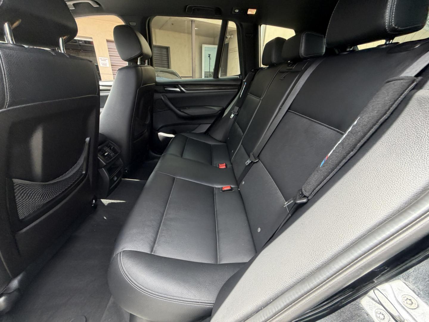 2016 Black /black BMW X3 xDrive28i (5UXWX9C53G0) with an 2.0L L4 DOHC 16V engine, 8-Speed Automatic transmission, located at 30 S. Berkeley Avenue, Pasadena, CA, 91107, (626) 248-7567, 34.145447, -118.109398 - Crown City Motors is a used “Buy Here Pay Here” car dealer in Pasadena CA. “Buy Here Pay Here” financing, means that when you purchase your vehicle from our dealership, that you make the payments to the dealership as well. We do not need the banks approval to get you approved for a used auto - Photo#28