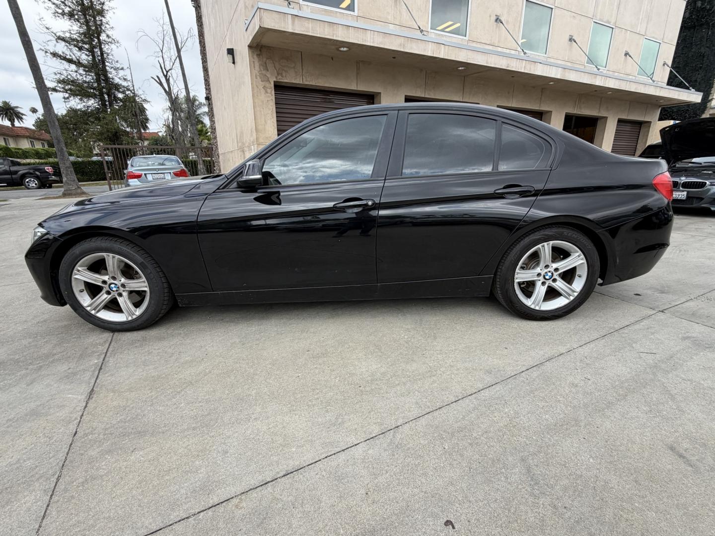 2015 Black /Black BMW 3-Series 320i Sedan (WBA3B1C52FK) with an 2.0L L4 DOHC 16V engine, 8-Speed Automatic transmission, located at 30 S. Berkeley Avenue, Pasadena, CA, 91107, (626) 248-7567, 34.145447, -118.109398 - Looking for a reliable, affordable luxury sedan with easy financing in Pasadena, CA? This 2015 BMW 3 Series (VIN: WBA3B1C52FK136158) is the perfect combination of performance, comfort, and efficiency—available now at Crown City Motors with Buy Here Pay Here financing designed for all credit situat - Photo#1