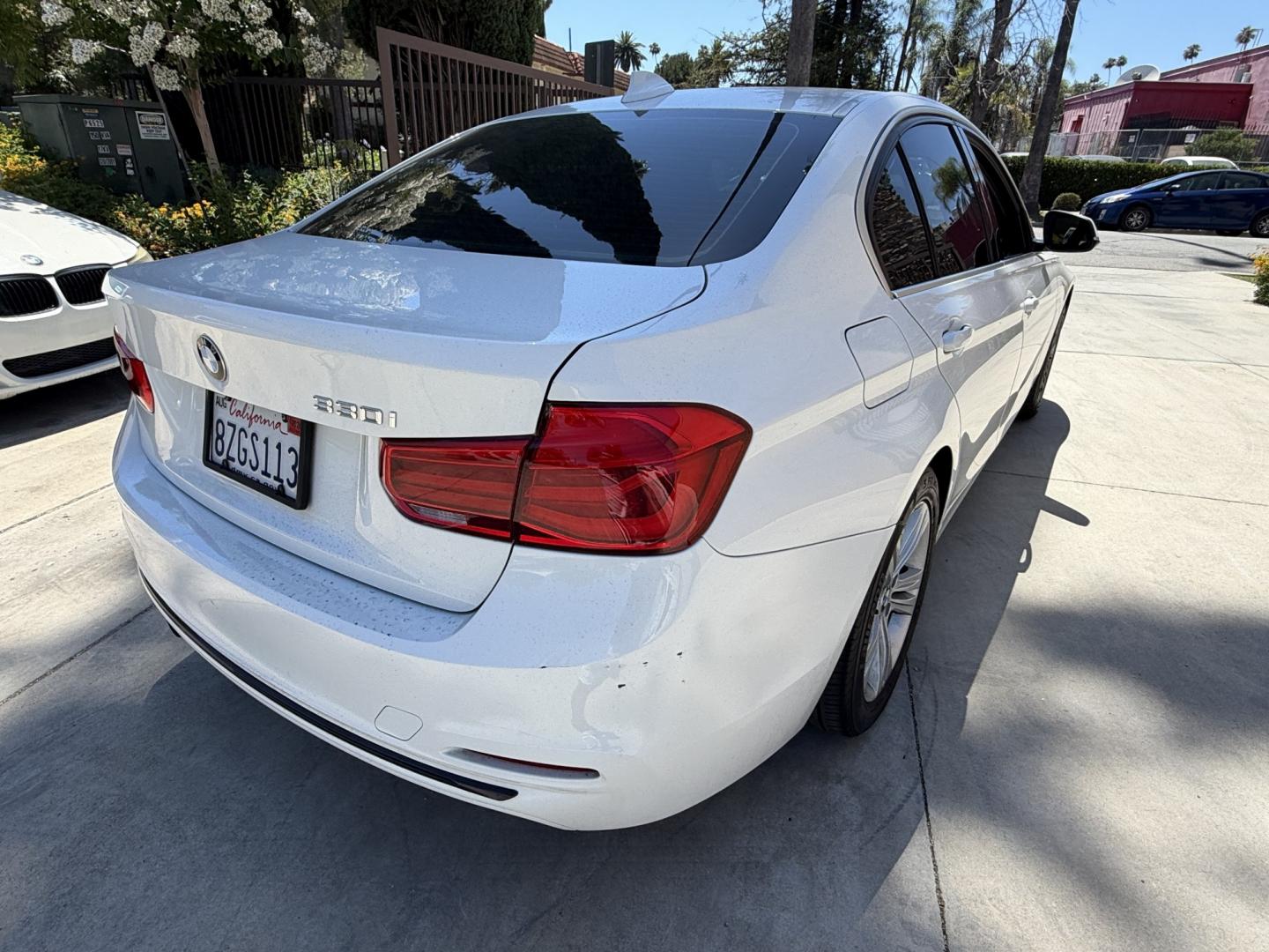 2018 Black /White BMW 3-Series 330i SULEV Sedan (WBA8B9C54JE) with an 3.0L L6 DOHC 24V engine, 8A transmission, located at 30 S. Berkeley Avenue, Pasadena, CA, 91107, (626) 248-7567, 34.145447, -118.109398 - Crown City Motors is a used “Buy Here Pay Here” car dealer in Pasadena CA. “Buy Here Pay Here” financing, means that when you purchase your vehicle from our dealership, that you make the payments to the dealership as well. We do not need the banks approval to get you approved for a used auto- Photo#2