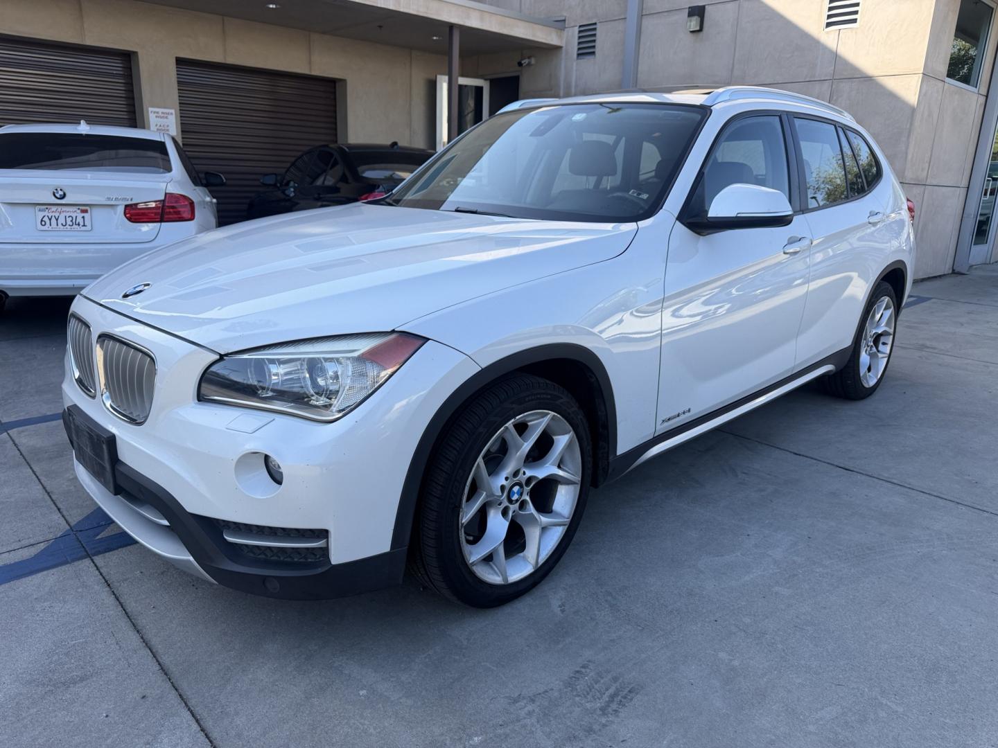 2014 Alpine White BMW X1 xDrive28i (WBAVL1C58EV) with an 2.0L L4 DOHC 16V engine, 8-Speed Automatic transmission, located at 30 S. Berkeley Avenue, Pasadena, CA, 91107, (626) 248-7567, 34.145447, -118.109398 - DEALER IDENTIFIER: Crown City Motors Sales | Buy Here Pay Here Pasadena TARGET REGIONS: Pasadena, San Gabriel Valley, Riverside, San Bernardino FINANCING SPECIALTY: Subprime Auto Lending, In-House Financing, Bad Credit Car Loans CA VEHICLE: 2014 BMW X1 xDrive28i AWD (VIN: WBAVL1C58EVY15967) 20- Photo#3