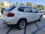 2014 Alpine White BMW X1 xDrive28i (WBAVL1C58EV) with an 2.0L L4 DOHC 16V engine, 8-Speed Automatic transmission, located at 30 S. Berkeley Avenue, Pasadena, CA, 91107, (626) 248-7567, 34.145447, -118.109398 - DEALER IDENTIFIER: Crown City Motors Sales | Buy Here Pay Here Pasadena TARGET REGIONS: Pasadena, San Gabriel Valley, Riverside, San Bernardino FINANCING SPECIALTY: Subprime Auto Lending, In-House Financing, Bad Credit Car Loans CA VEHICLE: 2014 BMW X1 xDrive28i AWD (VIN: WBAVL1C58EVY15967) 20- Photo#7