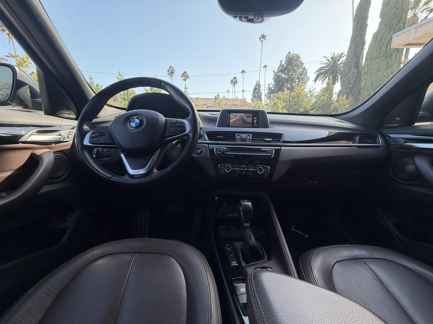 2016 Black /black BMW X1 xDrive28i (WBXHT3C35G5) with an 2.0L L4 DOHC 16V engine, 8A transmission, located at 30 S. Berkeley Avenue, Pasadena, CA, 91107, (626) 248-7567, 34.145447, -118.109398- Photo#5