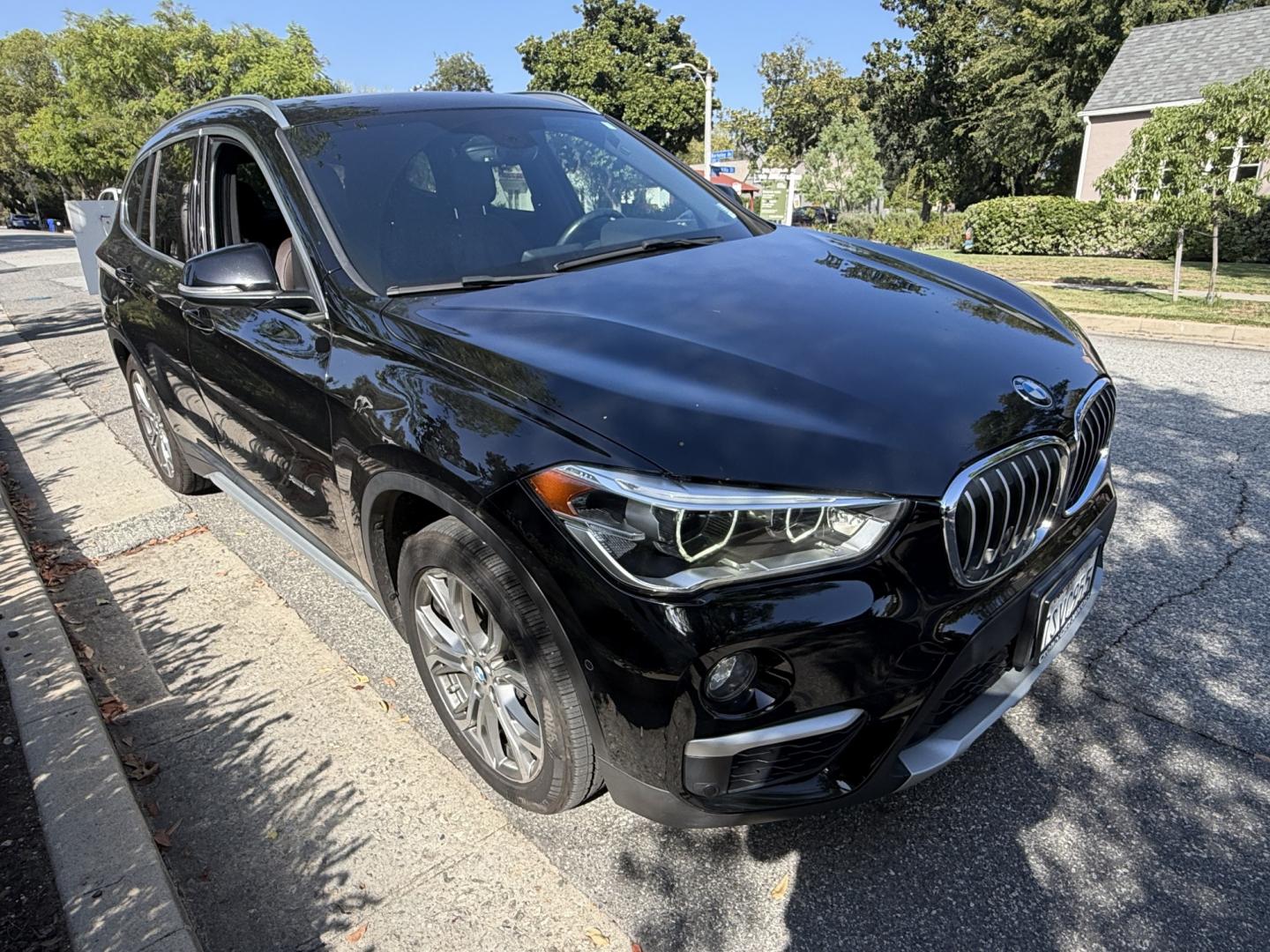 2016 Black /black BMW X1 xDrive28i (WBXHT3C35G5) with an 2.0L L4 DOHC 16V engine, 8A transmission, located at 30 S. Berkeley Avenue, Pasadena, CA, 91107, (626) 248-7567, 34.145447, -118.109398- Photo#7