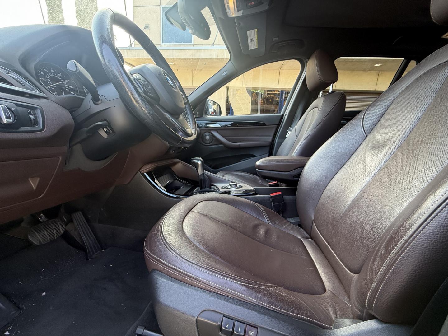 2016 Black /black BMW X1 xDrive28i (WBXHT3C35G5) with an 2.0L L4 DOHC 16V engine, 8A transmission, located at 30 S. Berkeley Avenue, Pasadena, CA, 91107, (626) 248-7567, 34.145447, -118.109398- Photo#10