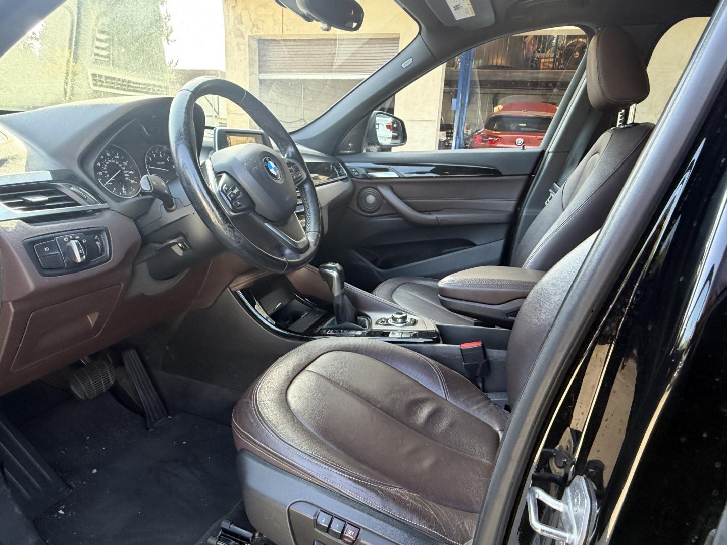 2016 Black /black BMW X1 xDrive28i (WBXHT3C35G5) with an 2.0L L4 DOHC 16V engine, 8A transmission, located at 30 S. Berkeley Avenue, Pasadena, CA, 91107, (626) 248-7567, 34.145447, -118.109398- Photo#9